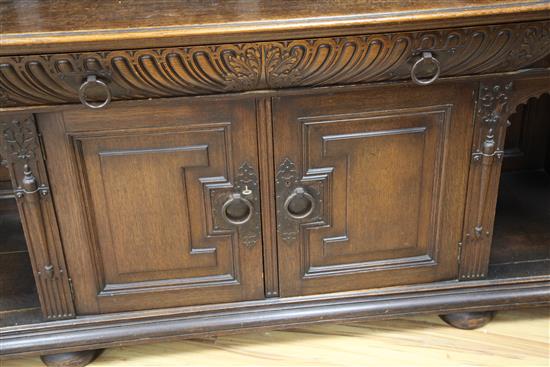A late 19th century large carved oak breakfront sideboard, W.7ft 9in.